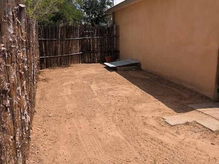Side yard is enclosed on 3 sides but tenant could enclose the 4th easily for pets.