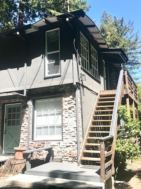 Stairwell leading to the upper unit and large entry deck.