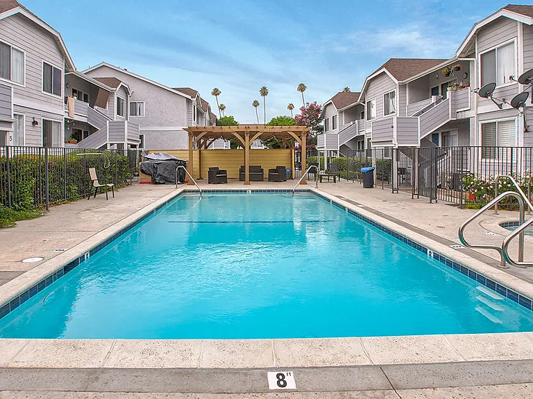 Large courtyard swimming pool, including jacuzzi and lounging area.
