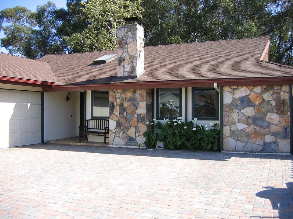 2 car garage; cobblestone surrounds the home