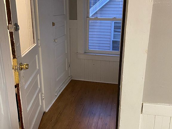 Entry to unit; attic storage through door in hallway