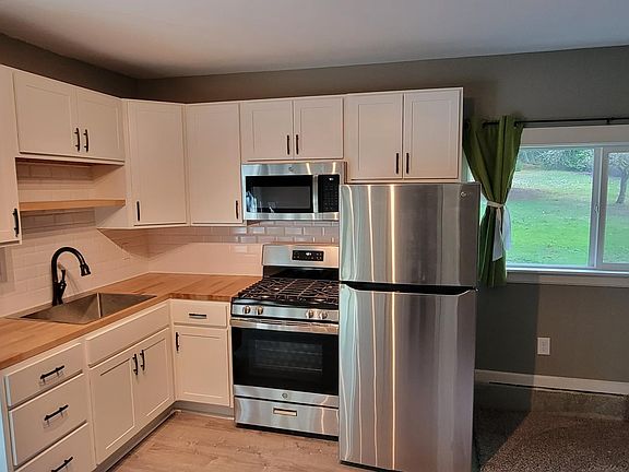 Full size refrigerator, range and microwave.