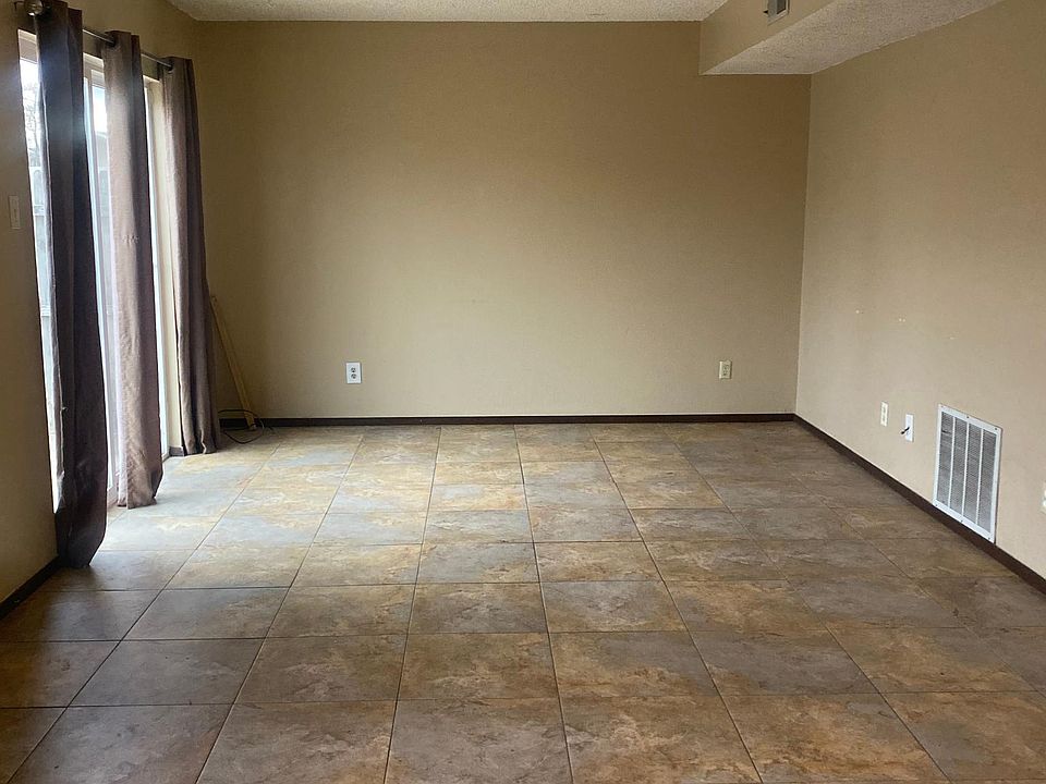 Living room with sliding doors to backyard.