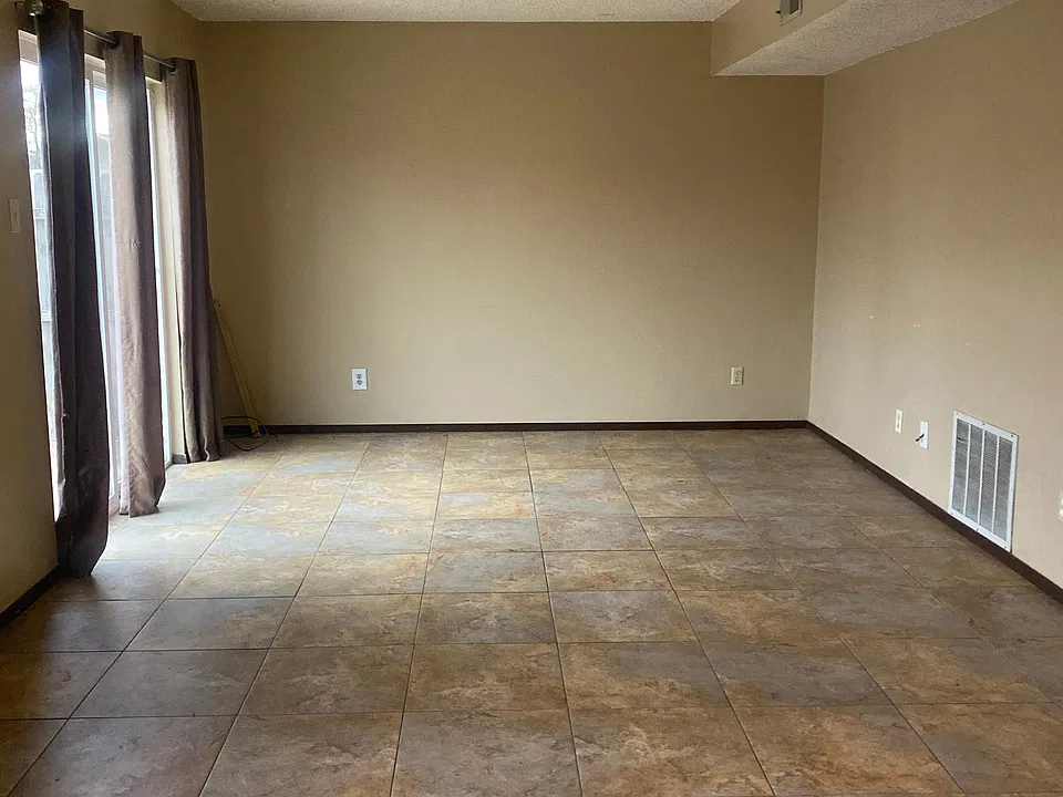 Living room with sliding doors to backyard.