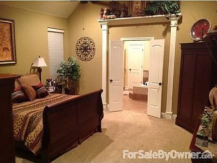 Master Suite : High ceiling, lots of cabinet extras and built-ins. TV plugs in bed & bath.
