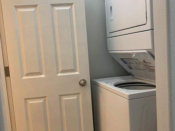 washing machine and dryer near half bathroom