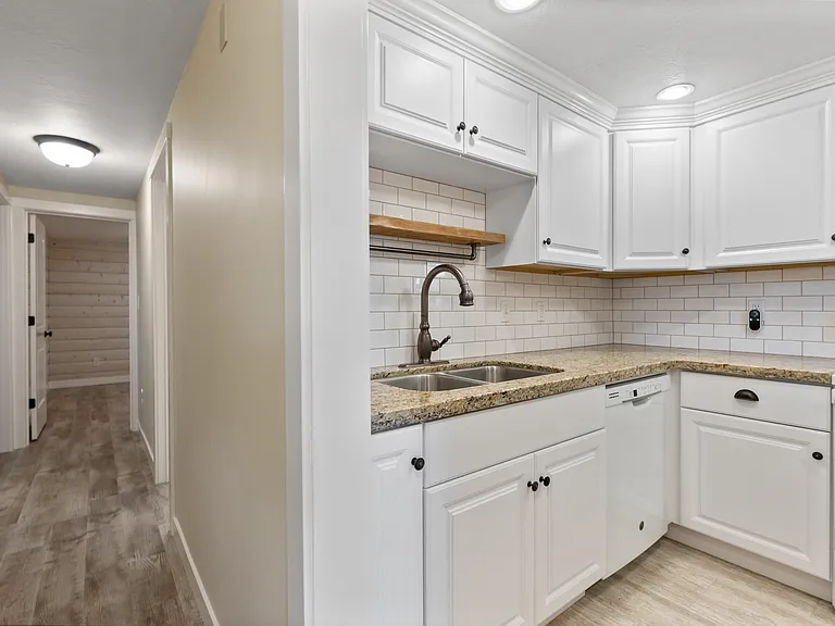 in-unit laundry room opposite to the kitchen (not shown)