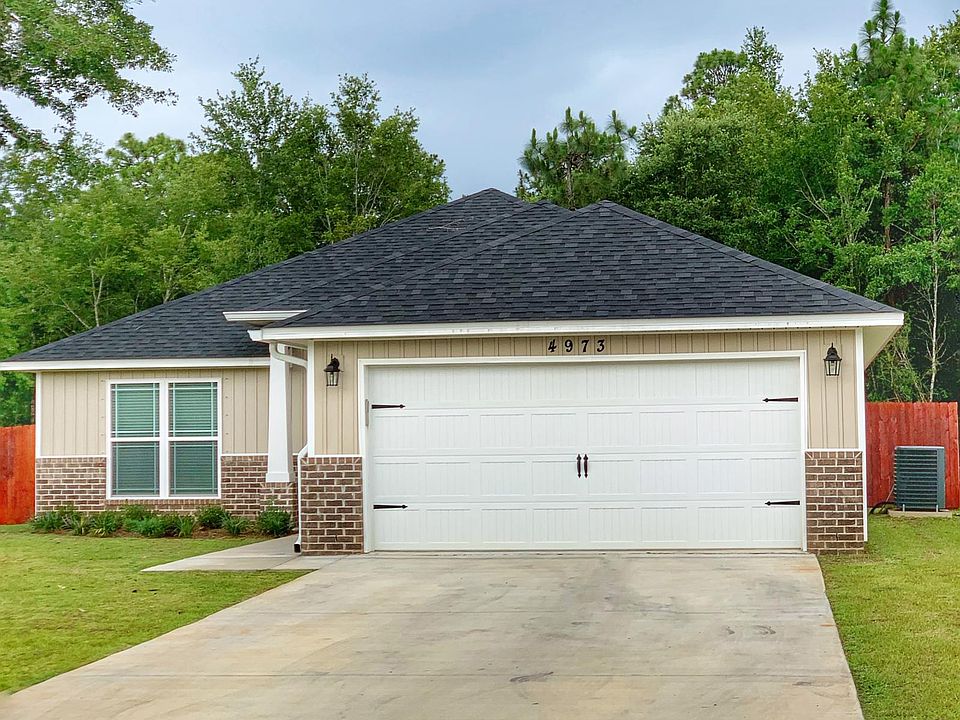 Two car drive way and huge garage.