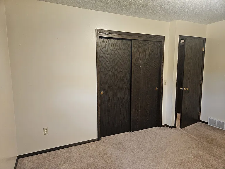 Bedroom #1 closet and doorway