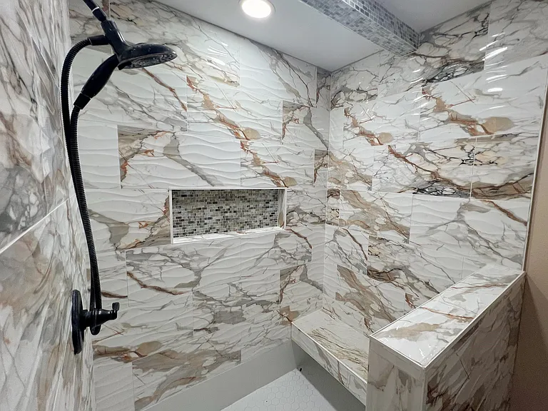 This shower is huge! And it has seating!
