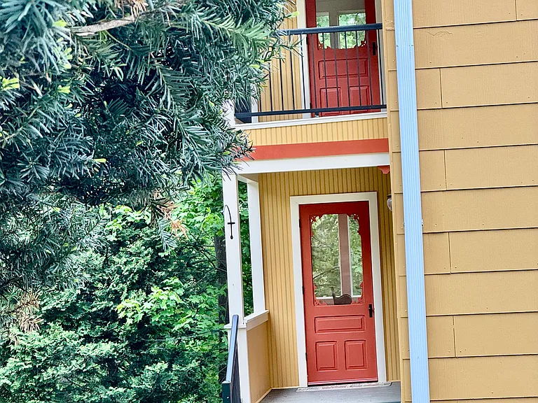 These two African mahogany custom porch doors, features adorned details of the aesthetic charm and beauty to this lovely two family gem, rock solid impeccably maintained home.