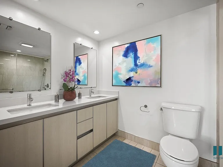Spacious Bathroom with Double-Sink Vanity and Cabinet Storage
