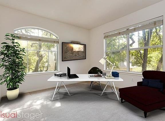 French doors open up to flex space with great natural light and is perfect for an office, game room or yoga space.