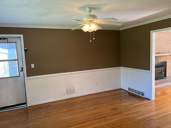 Family room view from kitchen with door to garage and living room