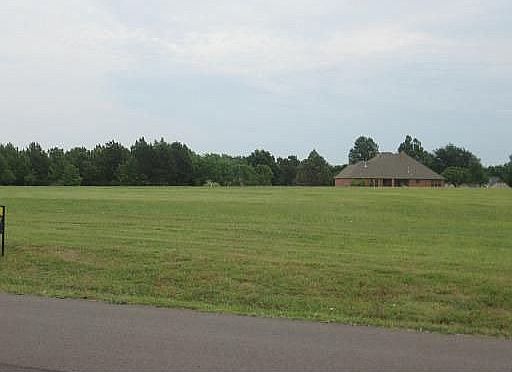 This is the vacant land ONLY. The home is not included in this listing!