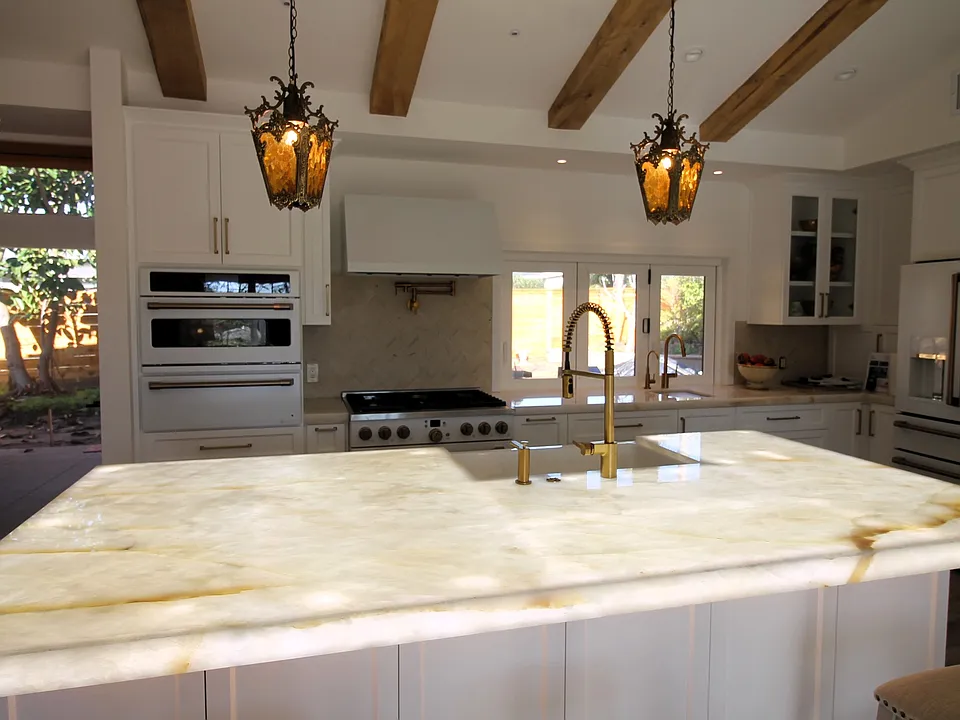 Kitchen w/New High End GE Cafe appliances & Illuminated Quartzite stone center island.