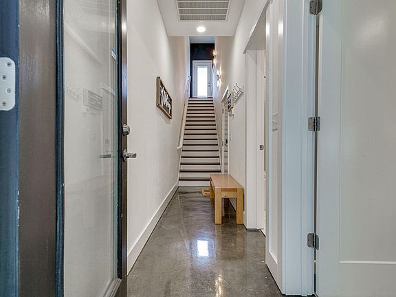 Entry on 1st Floor. There is also a Door Leading to the backside of the Home.