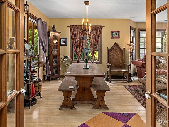 Interior glass french doors that swing into the dining area.>