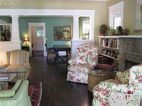 Architectural detail featured outside is used again in the square tapered balusters between living room and dining room.