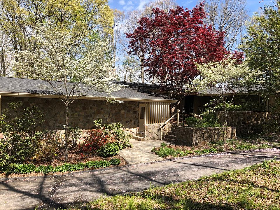 Extensive circular driveway in front of house.