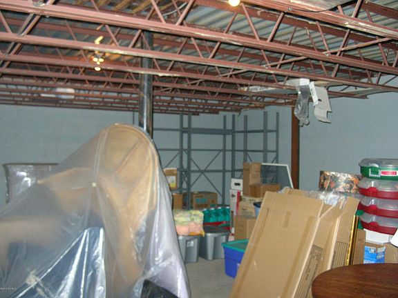 LOCATED BELOW THE DOUBLE CAR GARAGE