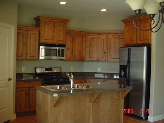 large kitchen, granite, stainless steel fully loaded, upgraded tiel, maple 