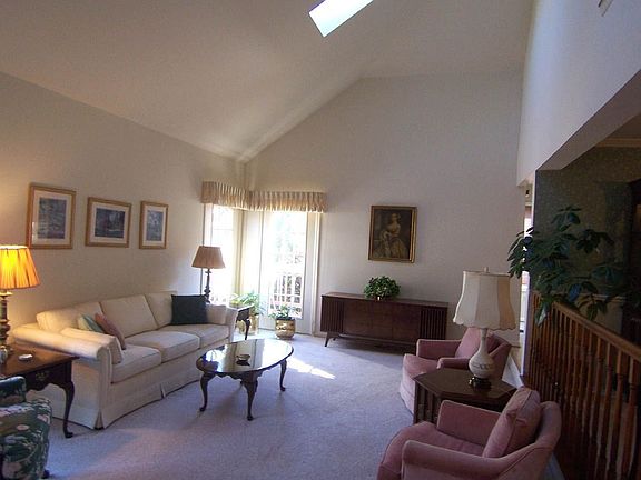 Living Room with High Vaulted Ceiling and Skylights