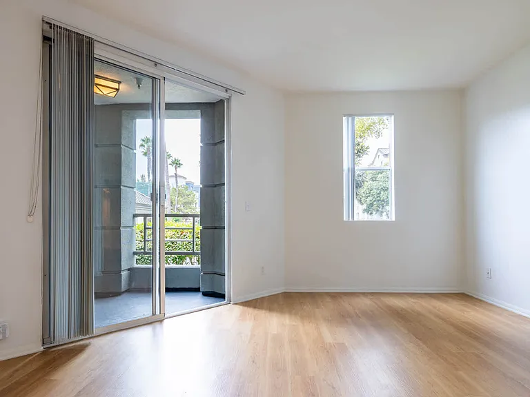 Bedroom with Balcony and Hard Surface Flooring