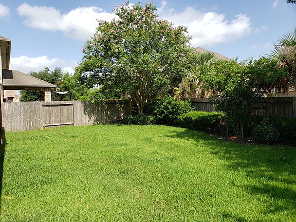 Huge backyard with porch.