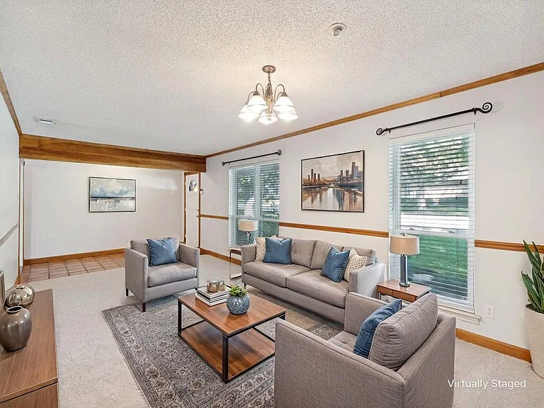 Updated Grand Room offers brand new carpet just installed. It's the perfect for a pool table, family game nights, or workspace.