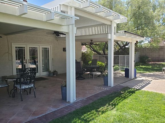 Custom Covered Patio with triple french doors and 3 ceiling fans