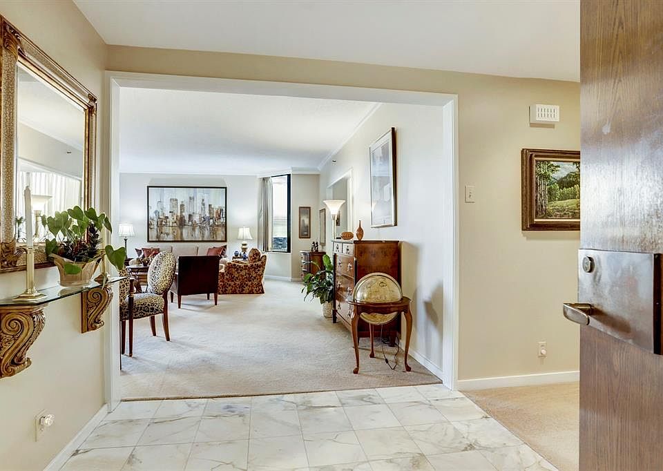 The entry with a marble floor greets you as you enter the apartment