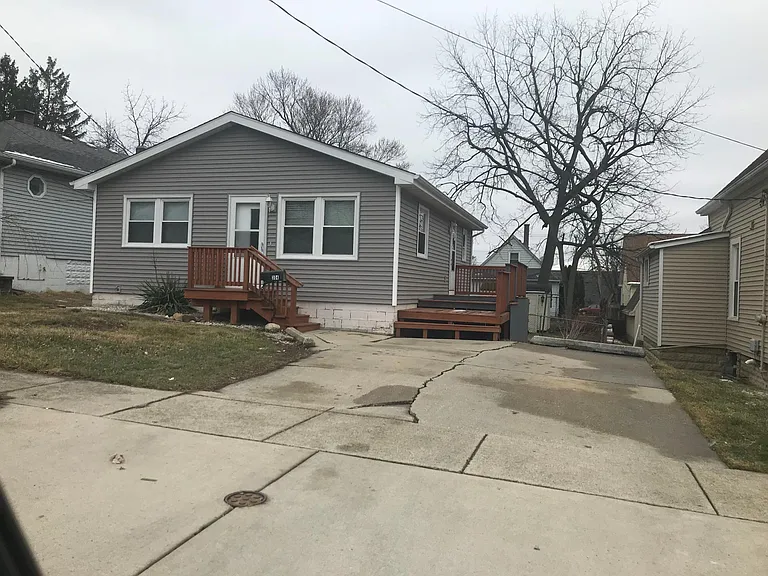 front of house, deck and driveway