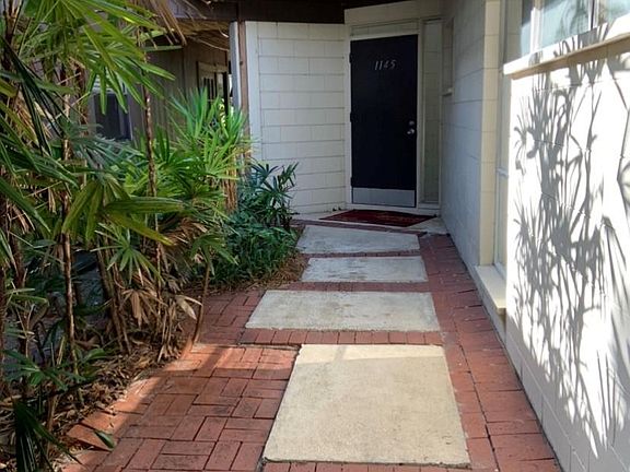 Private entrance from covered carport.
