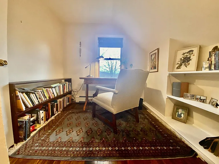 Smallest bedroom, currently used as a cozy office, overlooking the neighborhood, to the Catskills in the distance. Built in shelving and storage closet.