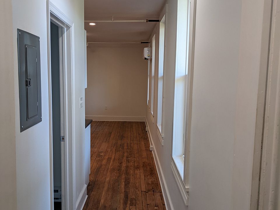 Hallway from bedroom to living room and bathroom