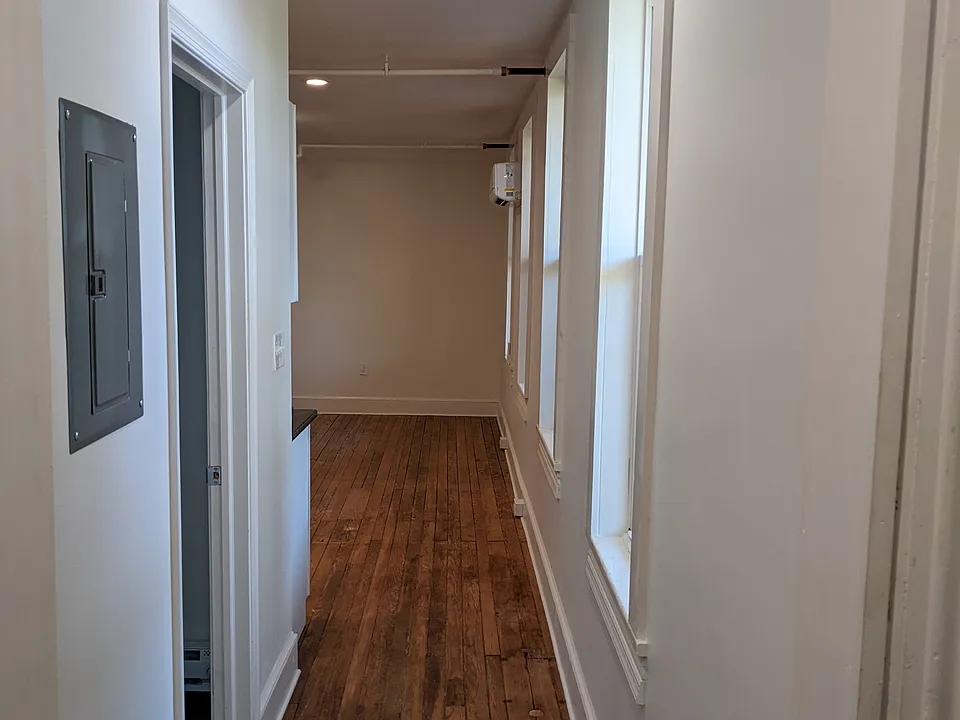 Hallway from bedroom to living room and bathroom