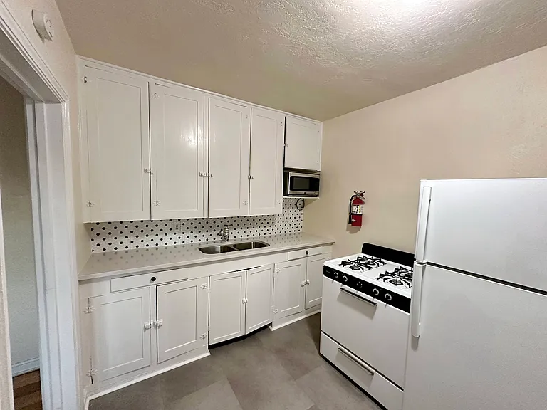 1107Tijeras-U12_KitchnClose_yr25_06082026