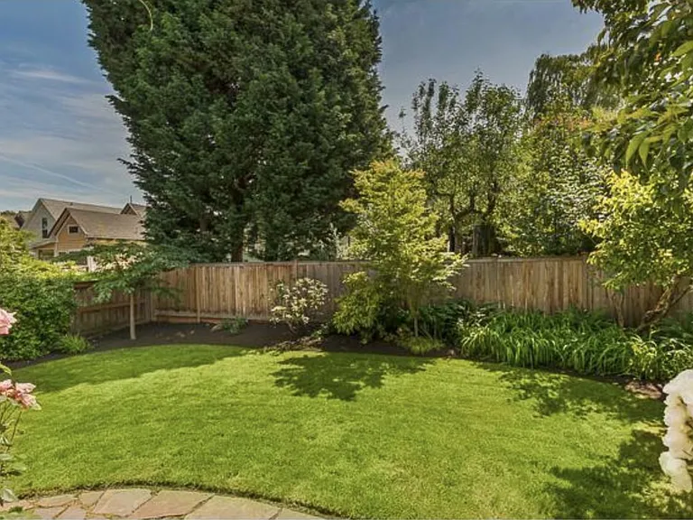 Fully landscaped backyard shared with lower unit.