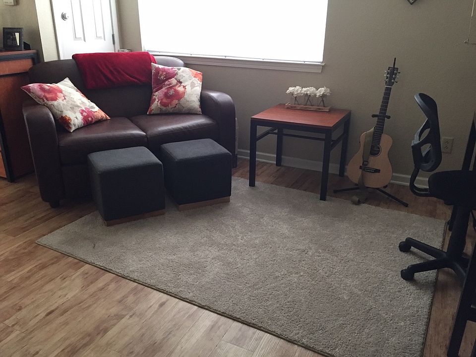 Family Room with sofa, arm chair, coffee table, desk and tv