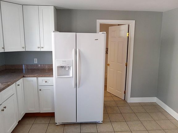 Eat-in Kitchen - sunny with lots of windows and light, solid wood white cabinets, granite countertops, ceramic tiled floor, all appliances