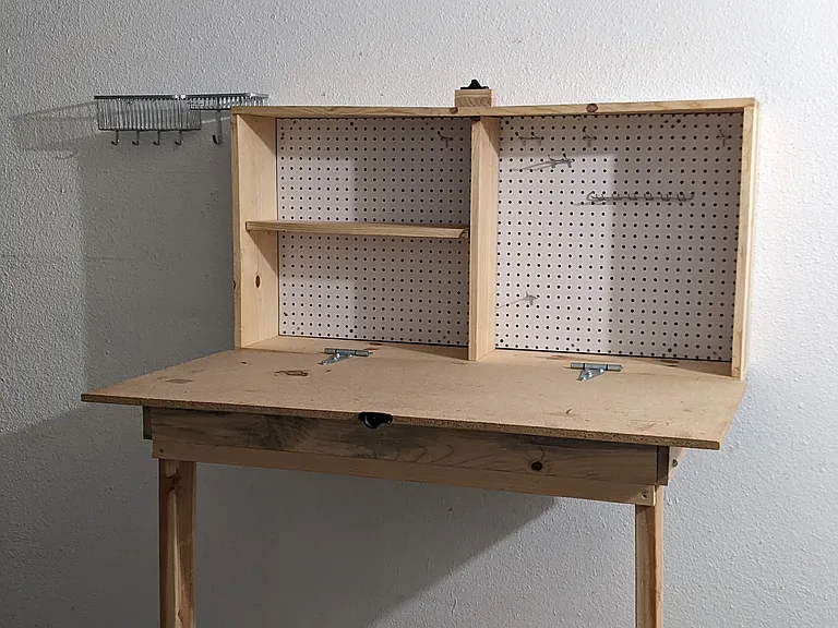 Garage work bench (closes by folding up).