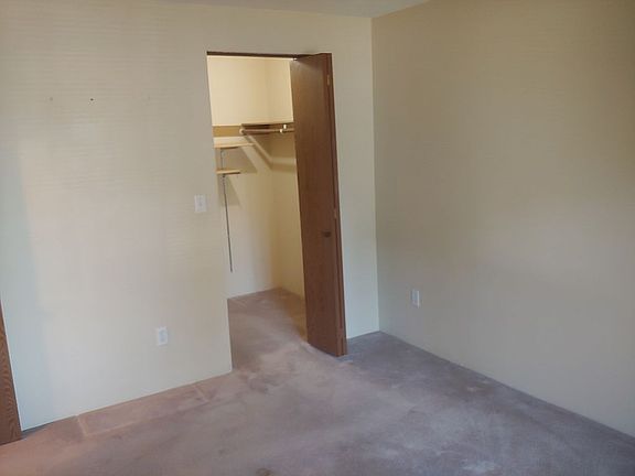 Bedroom with walk-in closet