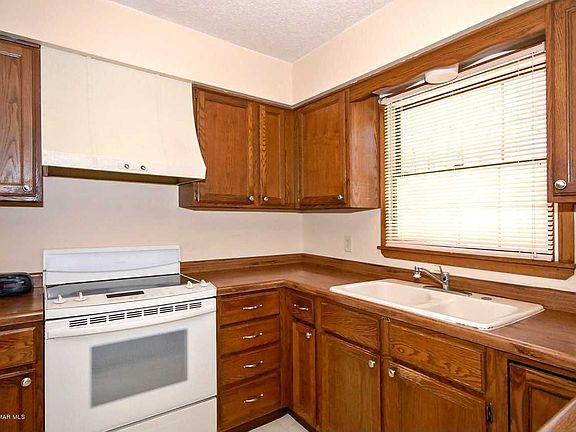 kitchen with oak cabinetry and pantry