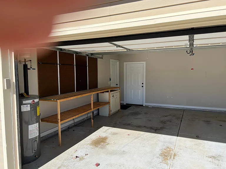 Large garage with workbench.
