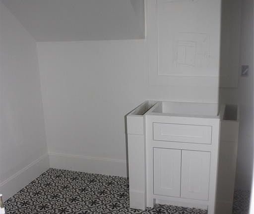 downstairs full bath off the study (or could be 5th bedroom) with Spanish cement tile floor