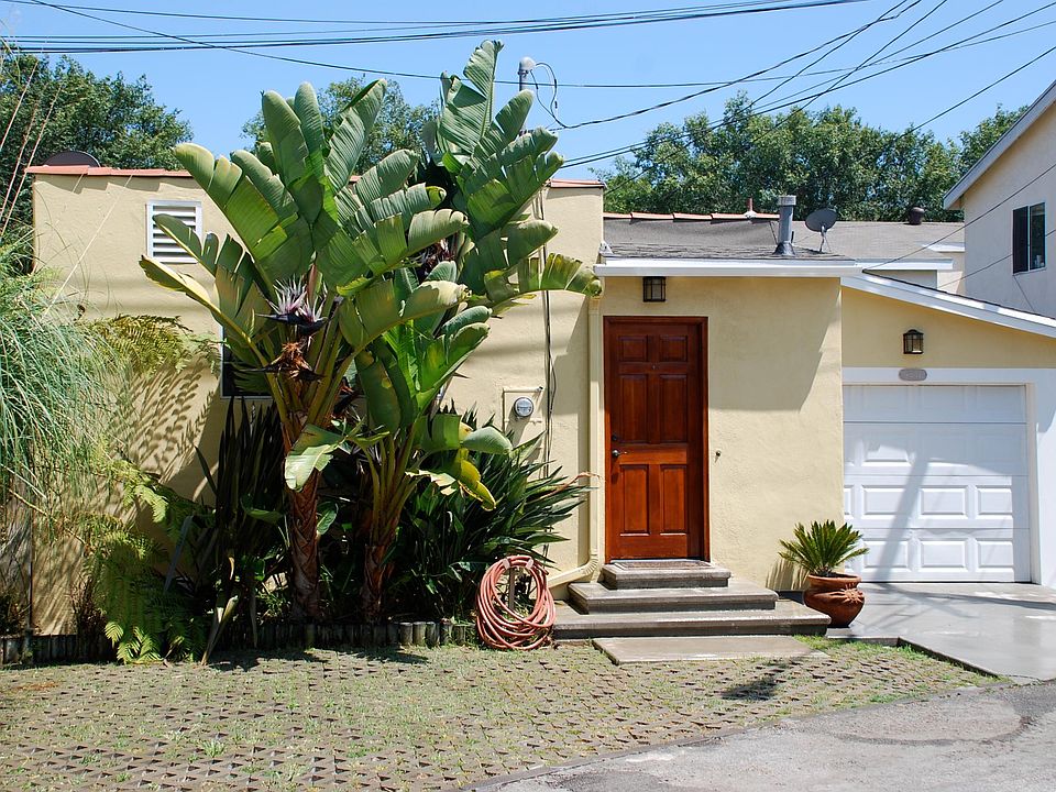 House entrance, with space to park two cars.