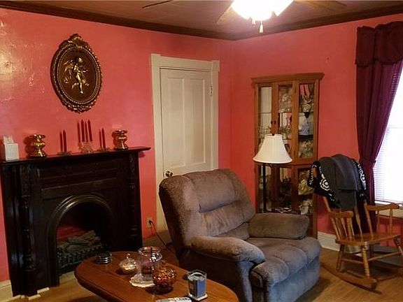 Living room with laminate flooring and electric fireplace