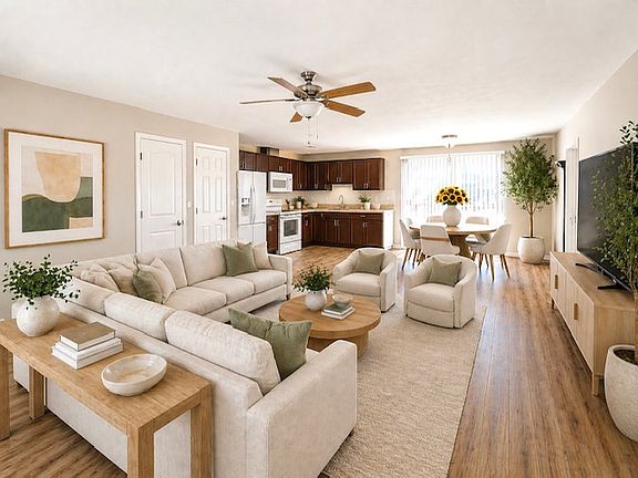 Open style living with patio doors leading out to deck and back yard.
Virtually staged.