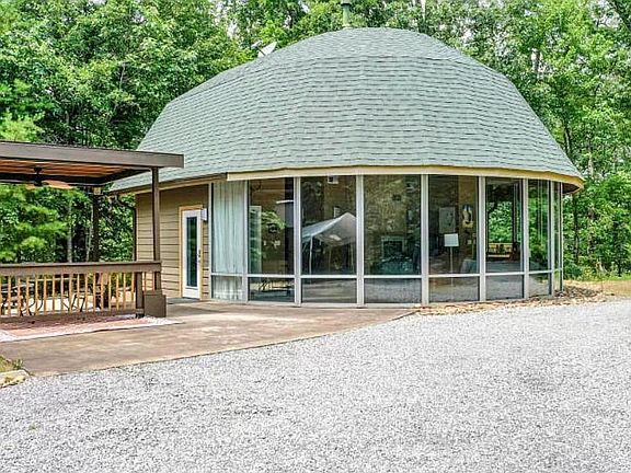 Front Entrance and Patio with TV , Charcoal Grill, and Fan